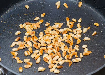 Toasting Pine Nuts in a Skillet Toasting Pine Nuts in a Skillet