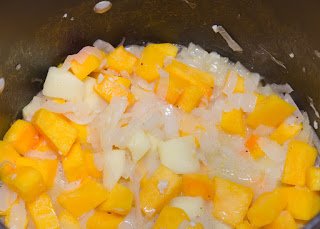 Butternut Squash and Onions Cooking in Olive Oil