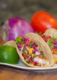 Tilapia Fish Tacos with Cabbage, Cheese, Avocado and Lime