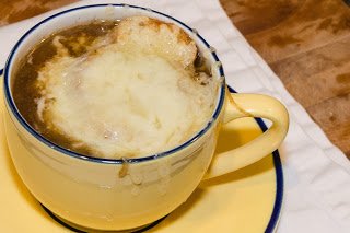 Cup of French Onion Soup with Melted Cheese