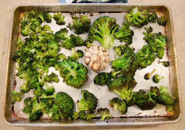 Roasted Broccoli and Roasted Garlic in a half sheet pan