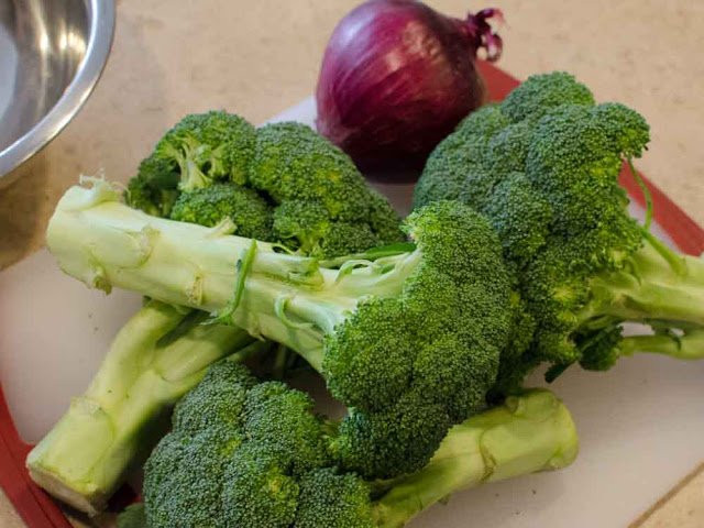 Fresh Broccoli and a Raw Red Onion