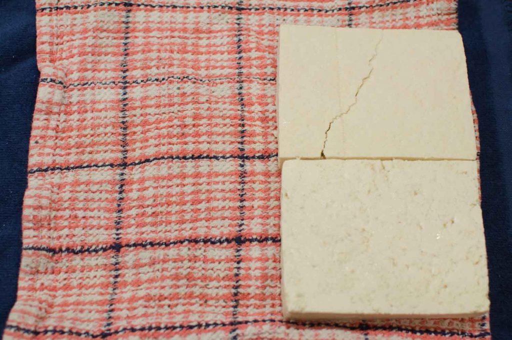 Extra Firm Tofu sliced in half