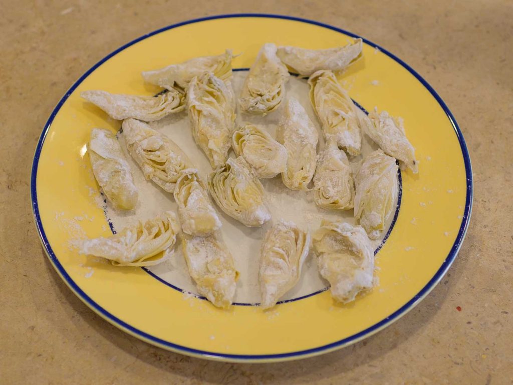 Quartered artichokes dusted in flour